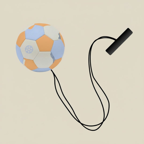 Colorful soccer ball with a black strap on a beige background