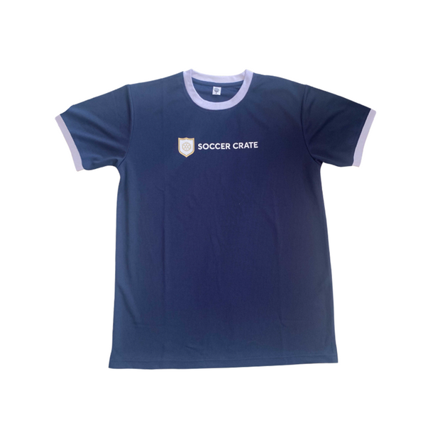 Photo of the navy Finesse Jersey with lilac-trimmed collar and sleeves and the Soccer Crate crest
